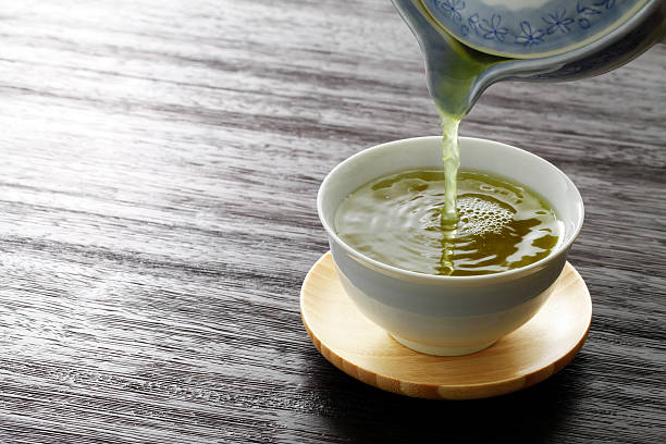pouring green tea